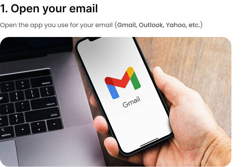 Hand holding phone with Gmail open